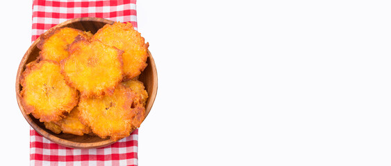 Canvas Print - The patacón, tostón, tachino, fried or chopped is a meal based on flattened fried pieces of green plantain, traditional in the culinary of several countries of Latin America and the Caribbean