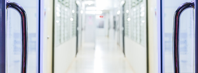 Aufkleber - Open door to hospital corridor pathway blurred background