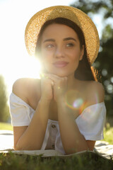 Wall Mural - Beautiful young woman in park on sunny day