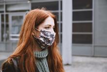 Young Woman Wearing Homemade Everyday Cloth Face Mask Outdoors In City, New Normal Covid-19 Corona Virus Pandemic Or Air Pollution Concept, Real People Lifestyle In Winter