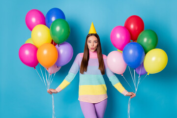 Sticker - Portrait of pretty funky cheerful girl holding in hands air balls having fun pout lips isolated bright blue color background