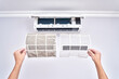 © amixstudio - Close up of a clean and dirty filter. Home air conditioner replacement and cleaning concept