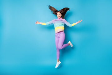 Canvas Print - Full length body size view of pretty sthin careless funky cheerful girl jumping having fun throwing hair isolated on bright blue color background