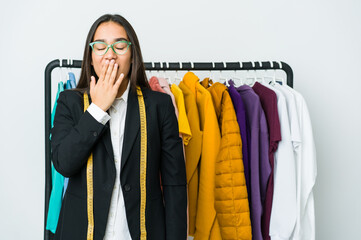 Wall Mural - Young asian designer woman isolated on white background yawning showing a tired gesture covering mouth with hand.