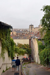 Poster - Stairs up the hill of Vieux Lyon to the Basilica Notre Dame de Fourviere and view over the roofs in Old Town of Lyon in France