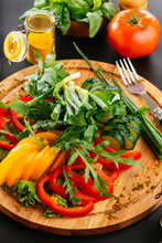 A Variety Of Vegetables Cut  On Wooden Plate
