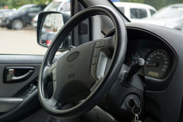 in the business class car interior, steering wheel, instrument panel