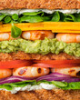 Club sandwich with shrimps, tomatoes, cheese, onions, avocado. Creative full frame photo. 