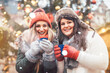© Kzenon - Best friends enjoying mulled wine on Christmas market
