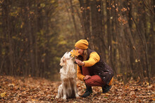 Portrait Of A Young Woman With A Dog In The Autumn Forest Close Up