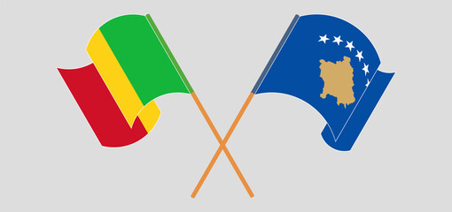 Crossed and waving flags of Mali and Kosovo