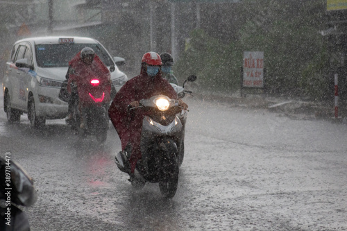 the stream of people is rushing away in the rain
