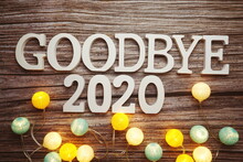 Goodbye 2020 Alphabet Letter With Cotton Ball LED Decoration On Wooden Background