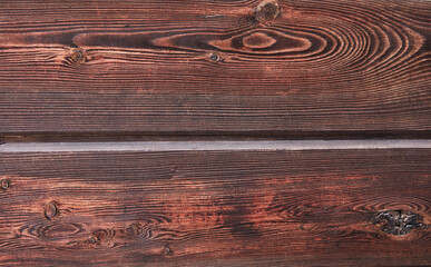 Texture of natural mahogany wood from two horizontal boards, background