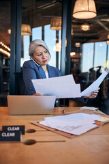 Sticker - Frustrated businesswoman talking on cellphone at work