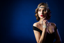 Retro Beauty Flapper Portrait, Woman Old Fashion Gatsby Hairstyle And Make Up, Blue Studio Background