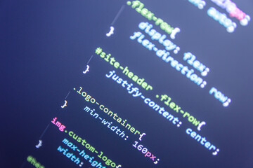 Website theme code close up. Laptop screen with CSS code