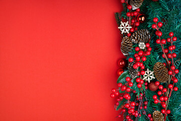 Christmas decorations on the red background. Top view with copy space for your text.