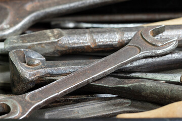 A box with a set of old rusty locksmith tools.