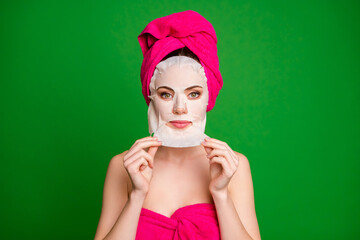 Sticker - Close-up portrait of healthy lady wearing turban removing facial mask therapy clean clear flawless skin isolated on bright green color background