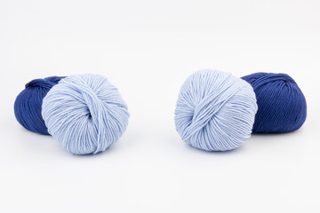 woolen merinos blue threads on white background. natural wool. knitting. background