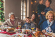 © Impact Photography - Family gathered for Christmas dinner