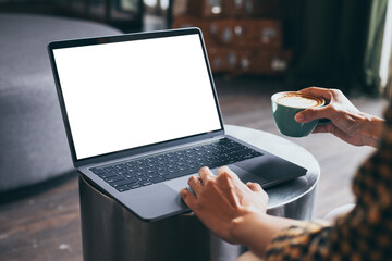 computer blank screen mockup.hand woman work using laptop with white background for advertising,contact business search information on desk at coffee shop.marketing and creative design