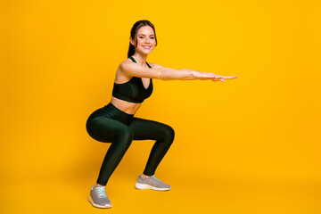 Wall Mural - Full length body size profile side view of her she attractive cheerful content girl doing sit-ups exercise isolated on bright yellow color background