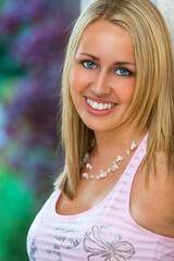 Wall Mural - portrait of young woman with blue eyes and perfect teeth