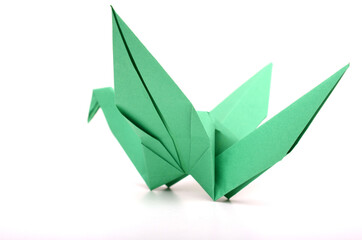 Wall Mural - A green paper origami bird