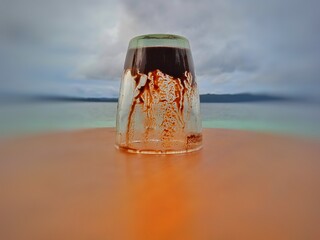 glass of champagne on the beach