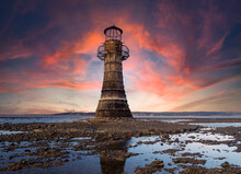This Derelict Iron Lighthouse Is Situated On Whiteford Sands,  The Gower, Swansea. It Is The Last Iron Lighthouse In Europe. Sun Setting At The End Of A Winter Day.