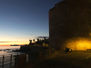 Wall Mural - sunset on seafront bastions in alghero, sardinia, italy