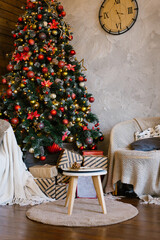 Stylish classic interior of a country house with a Christmas tree