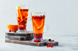 Orange and cranberry drinks with orange slices and spices. Hot drinks for winter and Christmas