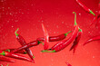 © Lukas Gojda - Red hot chilli peppers flying in freeze motion on red background