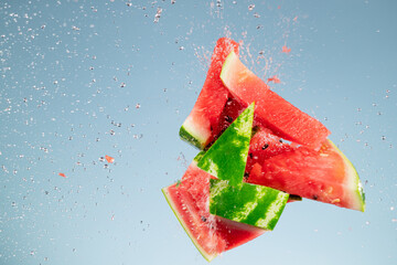 Wall Mural - Freeze motion of fresh melon with splashing water isolated on black background