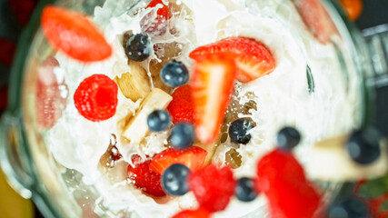 Wall Mural - Berries fresh smoothie blended in blender, top view. Healthy eating concept.