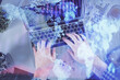 © peshkova - Double exposure of man's hands typing over laptop keyboard and forex chart hologram drawing. Top view. Financial markets concept.
