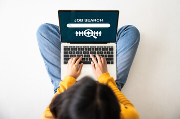 top view of woman sitting on floor and using laptop job search. online recruitment career business c