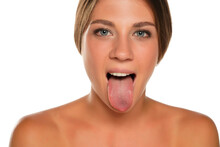 Young Beautiful Woman Sticking Out Her Tongue