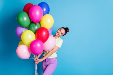 Sticker - Photo portrait of pretty girl holding pile of colorful air balloons smiling wearing casual clothes isolated on bright blue color background