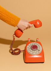 woman answering an old retro telephone