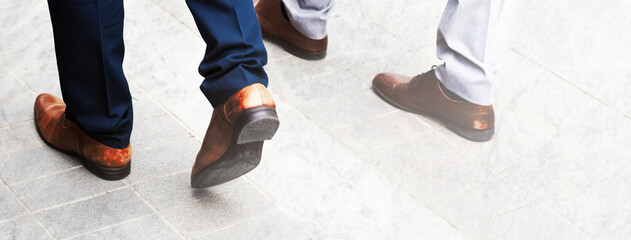 Business people walking on a pavement