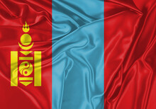 Mongolia Flag Waving In The Wind. National Flag On Satin Cloth Surface Texture. Background For International Concept.
