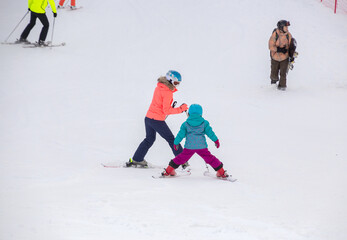 Sticker - family skiing  in the mountains