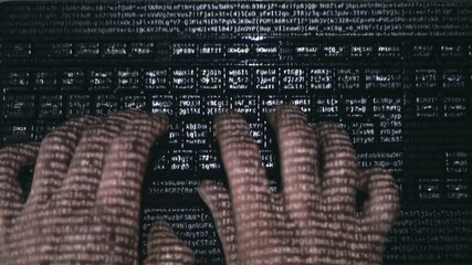 Male hands (hacker) quickly type on a computer keyboard on the surface of which various letters and numbers run, symbolizing the modern digital world