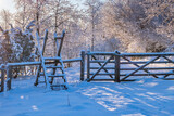 Fototapeta Most - Gate at a footpath with frost and snow