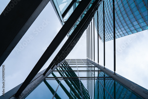 Fotografía Triangular abstract view on modern office building with sky