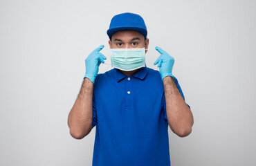 Wall Mural - Blue delivery asian man wearing protection mask and medical rubber gloves on isolated white background safety deliver concept.